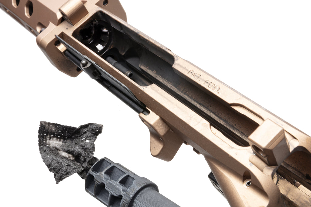 Chamber Scraper Tool removing carbon buildup from AR-15 locking lugs